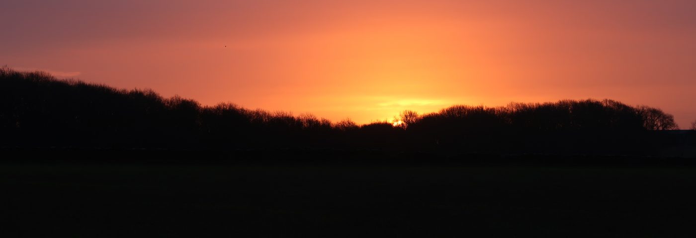 sunrise at Hazleton North long barrow, photo by Chris Cundy