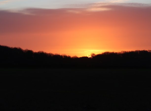 sunrise at Hazleton North long barrow, photo by Chris Cundy